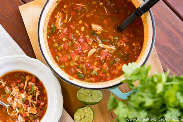 chicken tortilla soup in pot with lime
